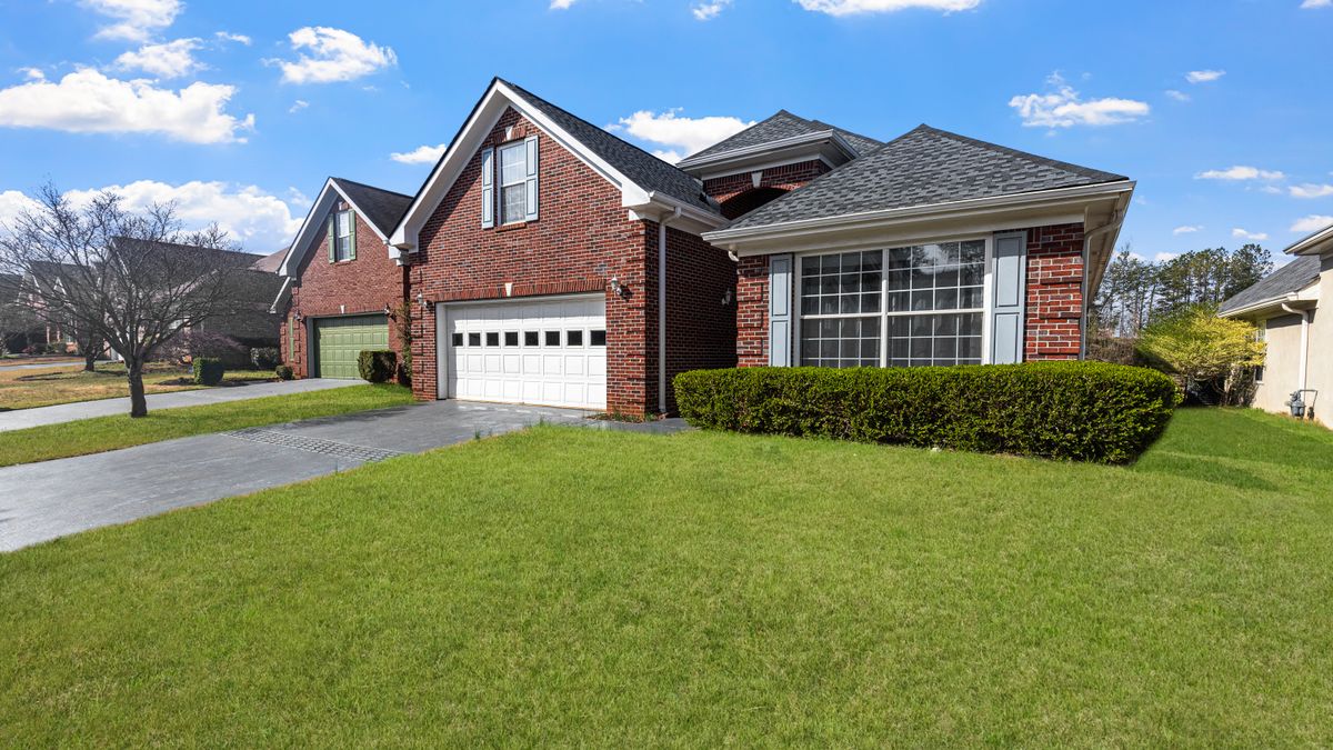 Single-story brick home with a lawn and attached garage, typical of the area's rental housing