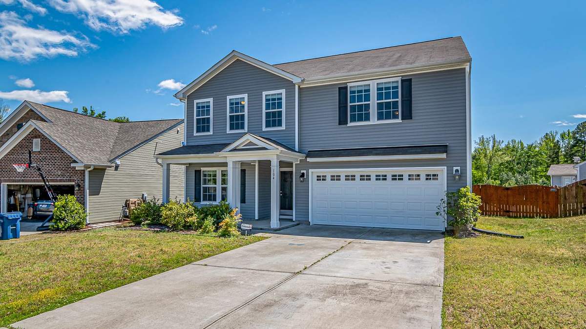 Newer two-story home with a concrete driveway, typical of Pooler subdivisions