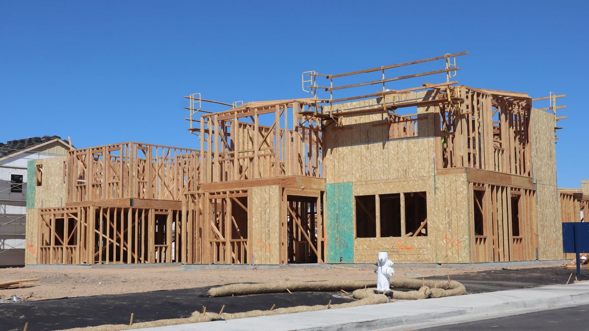 New house under construction with the wood framing up before the exterior goes on